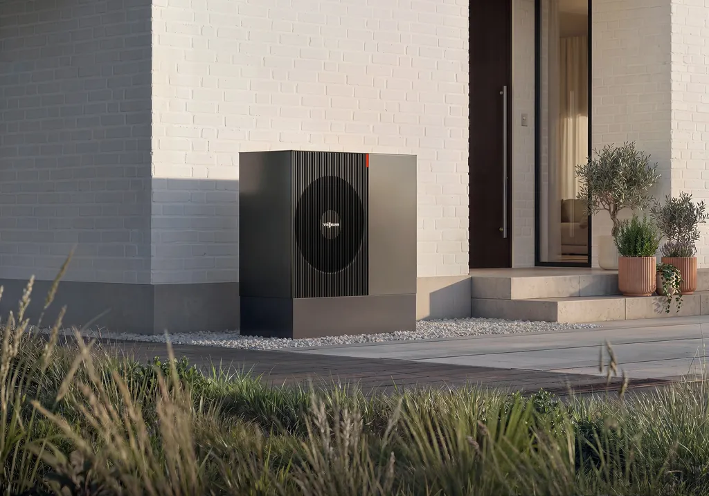 Viessmann Vitocal 200-A ie air-to-water heat pump beside the entrance of a light brick house